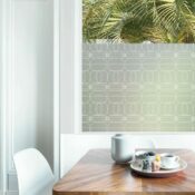 A linear patterned window privacy film looks elegant in a dining area.